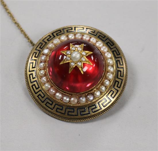 A Victorian yellow metal, enamel, split pearl and red paste? target mourning brooch, 40mm.